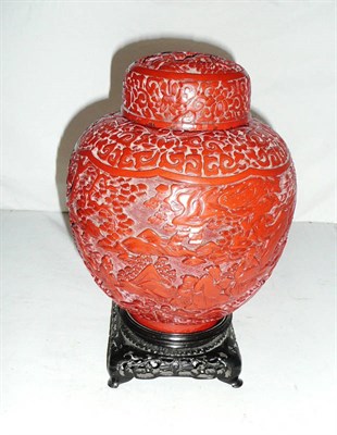 Lot 428 - A Chinese cinnabar lacquer vase, cover and stand