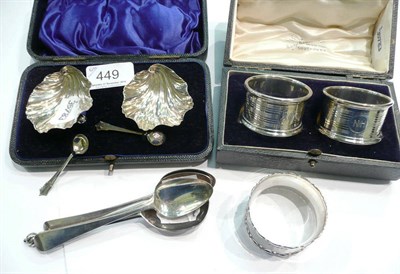 Lot 449 - Cased pair of silver napkin rings, cased silver salts, four silver spoons and another silver napkin