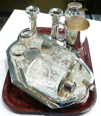 Lot 461 - A pair of loaded candlesticks, eight silver topped bottles, a plate mug and a plate entree dish