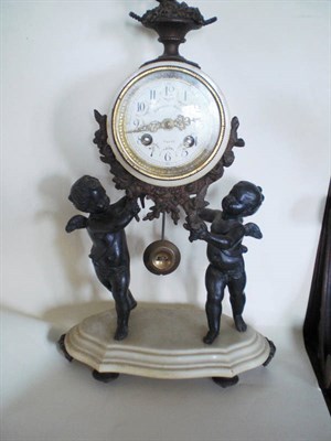 Lot 1324 - A Marble and Spelter Striking Mantel Clock, Duthuit-Boust, Dieppe, the case supported by two...