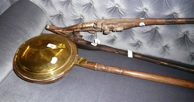 Lot 491 - Two Afghan rifles and a brass bed warming pan