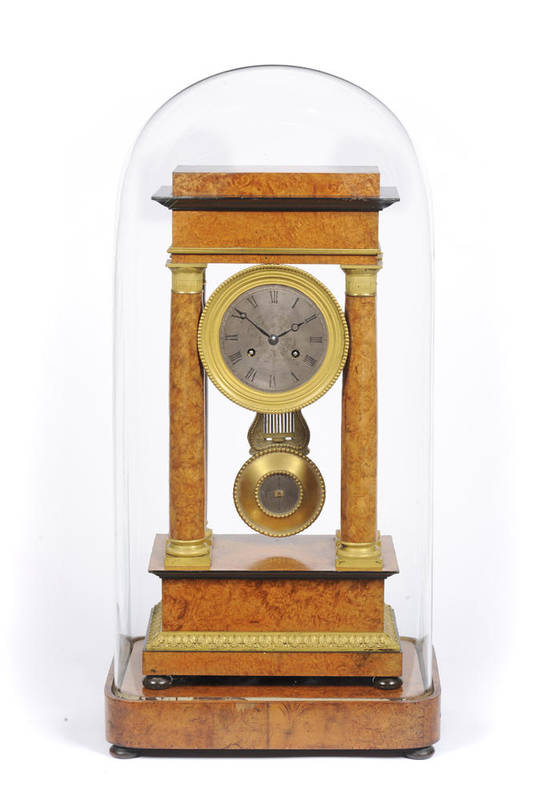 Lot 1329 - A French Amboyna Portico Striking Mantel Clock, 19th Century, the figured case supported by...