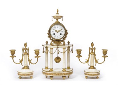 Lot 1331 - A Gilt Metal and White Marble Striking Mantel Clock with Garniture, circa 1890, the case surmounted