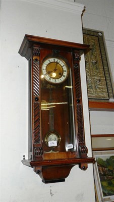 Lot 574 - A walnut Vienna-style wall clock