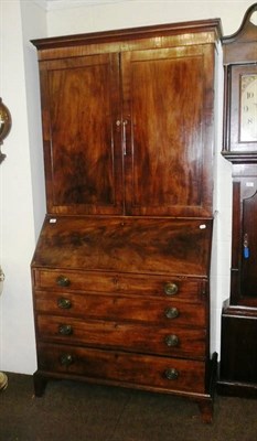 Lot 578 - A George III mahogany bureau bookcase, with moulded cornice above two flame mahogany  panel...