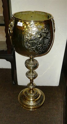 Lot 581 - Embossed brass pedestal jardiniere on stand