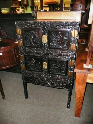 Lot 620 - Chinese hardwood cabinet