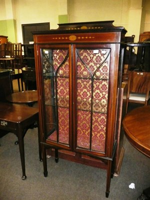 Lot 630 - An Edwardian inlaid mahogany display cabinet