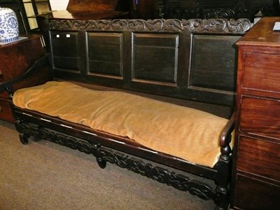 Lot 636 - A 19th century carved oak settle