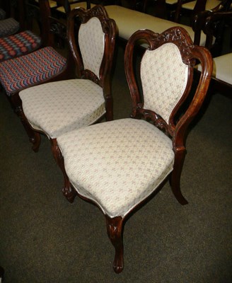 Lot 661 - Pair of carved walnut upholstered salon chairs