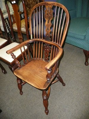 Lot 664 - A yew wood Windsor chair