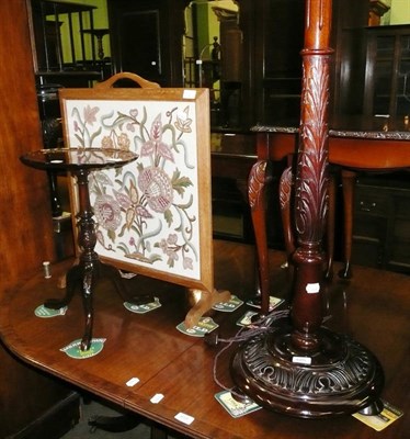 Lot 685 - Carved oak standard lamp, a reproduction wine table and an oak fire screen