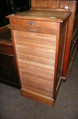 Lot 689 - Oak tambour-fronted music cabinet