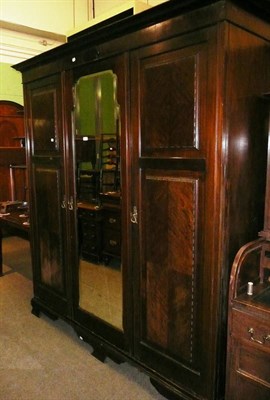 Lot 697 - Mahogany triple wardrobe