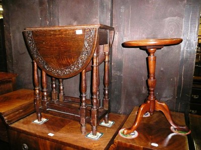 Lot 702 - Small carved oak drop leaf occasional table and a wine table