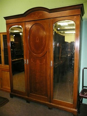 Lot 709 - Edwardian inlaid walnut triple wardrobe