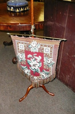 Lot 723 - A mahogany polescreen with beadwork banner and a Victorian footstool (2)