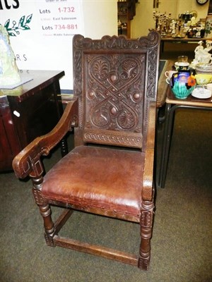 Lot 729 - Pair of carved oak open armchairs dated 1890