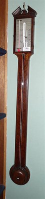 Lot 1366 - A Mahogany Stick Barometer, the case with broken arched pediment, hinged door with latch,...