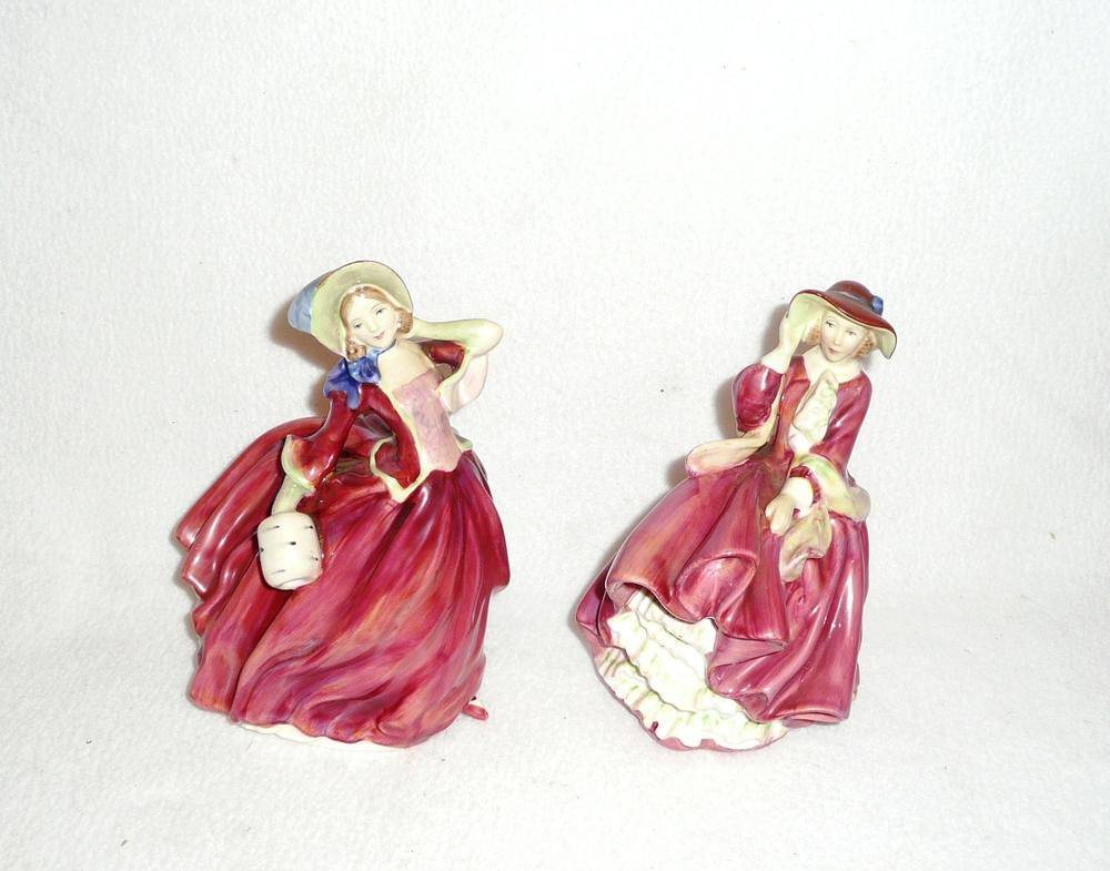 Lot 23 - Two Royal Doulton china figures 'Top O' The Hill' HN1937 and 'Autumn Breezes' HN1934