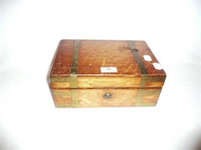 Lot 26 - An Asprey brass bound oak jewellery box, lacking fittings