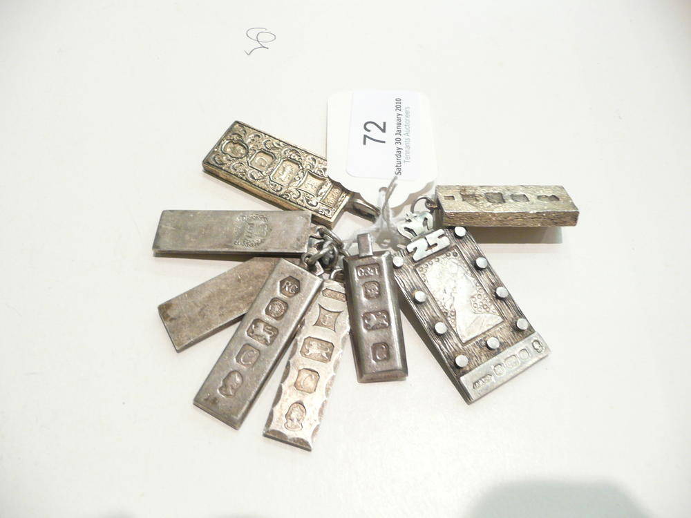 Lot 72 - Eight silver ingot pendants