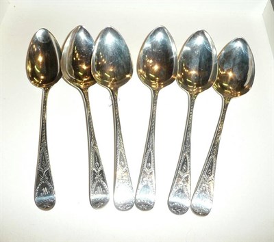 Lot 85 - Set of six George III silver bright cut engraved dessert spoons