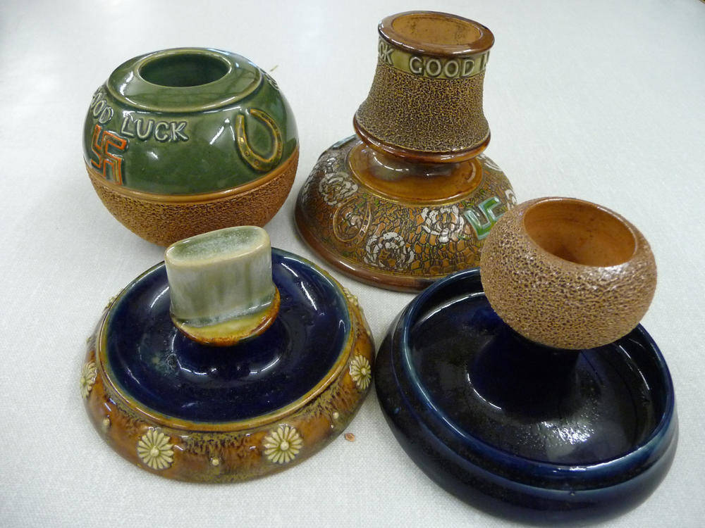 Lot 106 - Three Royal Doulton stoneware match strikers and a Royal Doulton ashtray