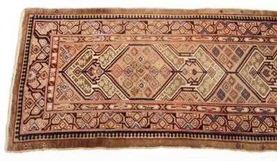 Lot 1377 - A Serapi Runner, the camel field with four extended diamond and arrowhead medallions, within an...