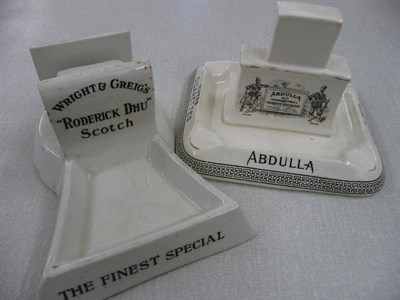 Lot 121 - An Abdulla cigarette match box holder/ashtray and a Wright and Griegs match box holder