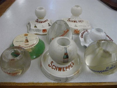 Lot 124 - Seven assorted Schweppes advertising strikers and a bottle stand