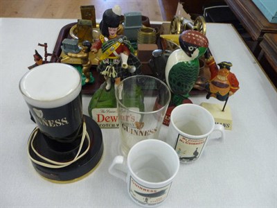 Lot 134 - Advertising items including Dewars whisky figure, Bulmers coder and assorted metal strikers