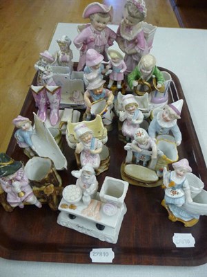 Lot 140 - Two trays of assorted china figures and match strikers