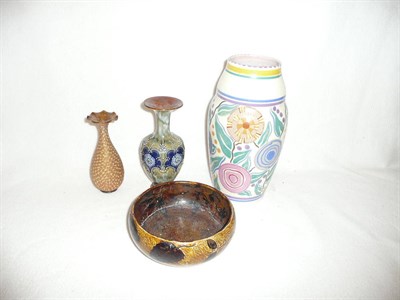Lot 146 - Three pieces of Doulton ware and a Poole vase