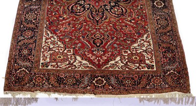 Lot 1383 - A Mahal Carpet, the field with a typical radiating red and blue palmette medallion on a red...