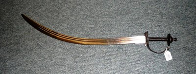 Lot 203 - A late 18th/early 19th century Indian Talwar, the 71cm curved steel blade with two narrow...