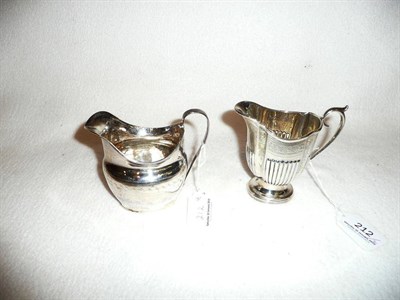 Lot 212 - A silver cream jug by Walker & Hall and a Georgian silver cream jug (2)