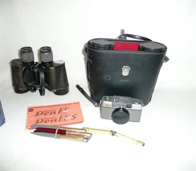 Lot 229 - An ivory folding rule, five various fountain pens, two pairs of binoculars and an Olympus camera