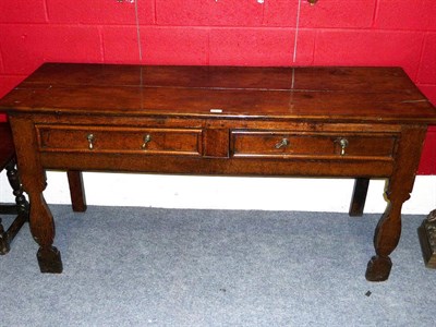 Lot 1390 - An Early 18th Century Oak Dresser, the boarded top over two frieze drawers, on profile-cut baluster