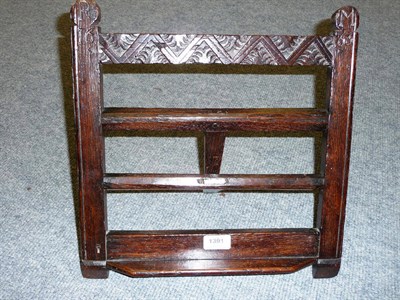 Lot 1391 - A Small Carved Oak Book Stand, dated 1666 and initialled R M, the carved top rail between...