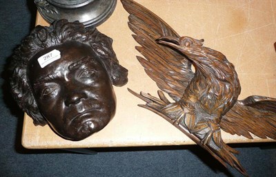 Lot 287 - A composition figural head possibly Beethoven together with a carving of an eagle