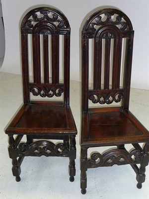 Lot 1396 - A Pair of Early 18th Century Joined Oak Chairs, the vertically railed backs with arched and...