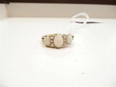 Lot 308 - An opal and diamond fancy half hoop ring