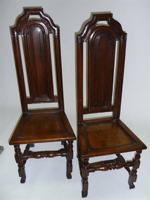 Lot 1397 - A Pair of Early 18th Century Joined Oak Chairs, the high narrow backs with shaped and moulded...