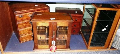 Lot 314 - Smokers cabinet, small display cabinet and two small chests