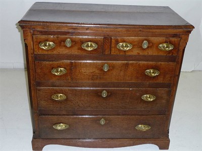 Lot 1398 - An Early 18th Century Oak Chest of Drawers, the rectangular top with moulded edge, above two...