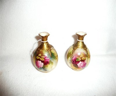 Lot 326 - A pair of small Royal Worcester vases decorated with roses