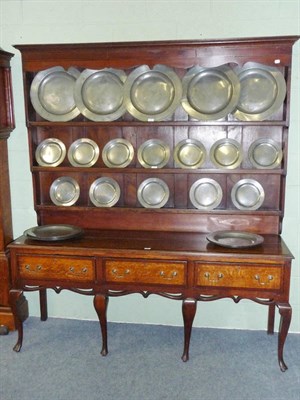 Lot 1399 - An Oak and Mahogany Crossbanded Dresser and Rack, the projecting cornice above a shaped apron...