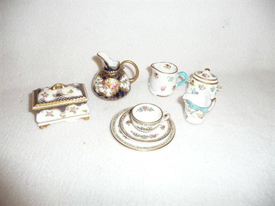 Lot 334 - A group of six miniature items - a trio, three jugs, sugar basin and cover and a box and cover...