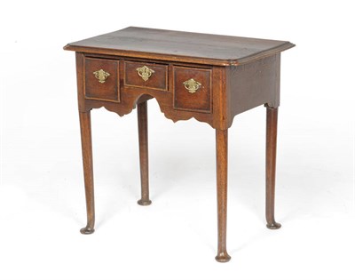 Lot 1400 - A George II Oak Lowboy, the rectangular top with moulded edge above a central frieze drawer flanked